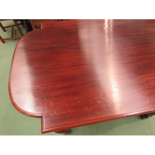 4098 - A mid Victorian mahogany library centre table, the breakfront top on turned and reeded legs with flu... 