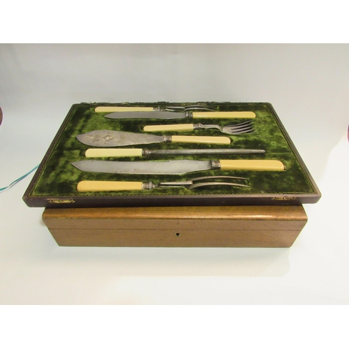 4298 - An ivorine handled double carving set and fish knife and fork set in case a/f and a part oak canteen... 