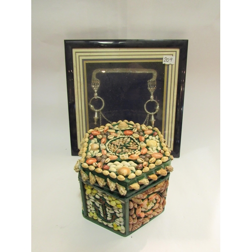 4302 - An Arabic white metal adornment in box frame and a hexagonal shell decorated lidded box with treen c... 