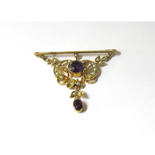 9377 - A gold bar brooch stamped 9ct suspended with a scroll and swag seed pearl and amethyst panel and ame... 