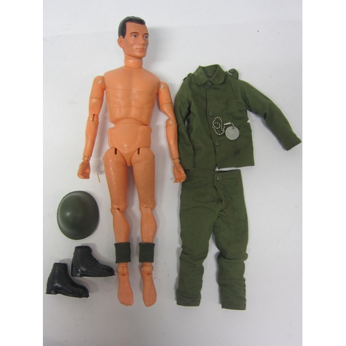 8251 - An unboxed Pedigree 'Tommy Gunn' soldier action figure wearing green helmet, gaiters and fatigues, b... 