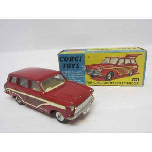 8138 - A boxed Corgi Toys 491 diecast Ford Consul Cortina Super Estate Car in red with white interior