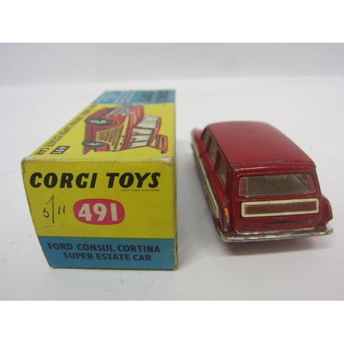 8138 - A boxed Corgi Toys 491 diecast Ford Consul Cortina Super Estate Car in red with white interior