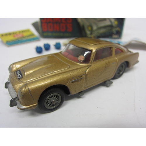 8132 - A boxed Corgi Toys 261 diecast James Bond Goldfinger Aston Martin DB5 in gold with red interior, wit... 