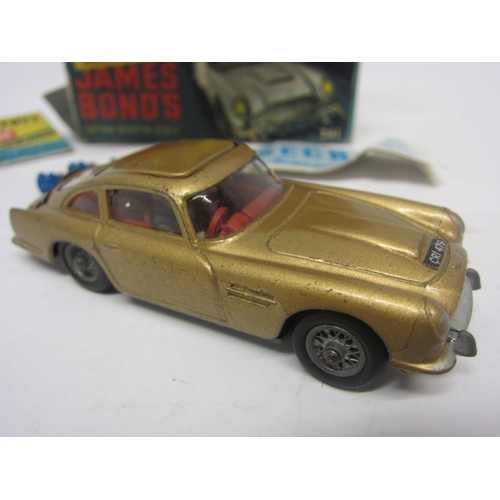 8132 - A boxed Corgi Toys 261 diecast James Bond Goldfinger Aston Martin DB5 in gold with red interior, wit... 