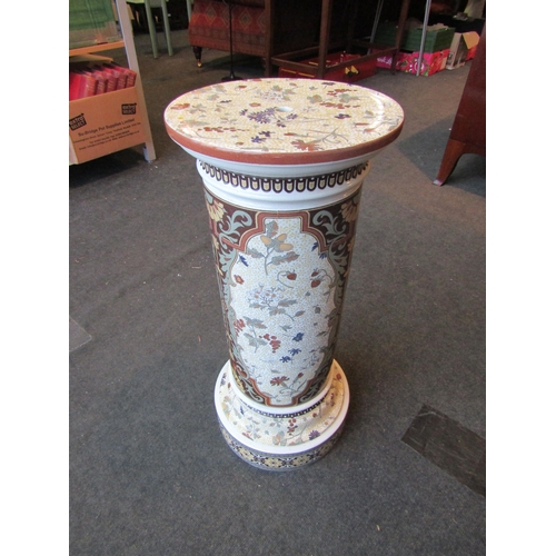 1004 - A Victorian pottery jardiniere stand with floral design, 69cm tall