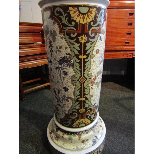 1004 - A Victorian pottery jardiniere stand with floral design, 69cm tall