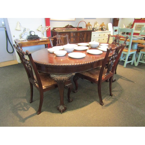 1082 - A Georgian mahogany extending dining table retailed by 