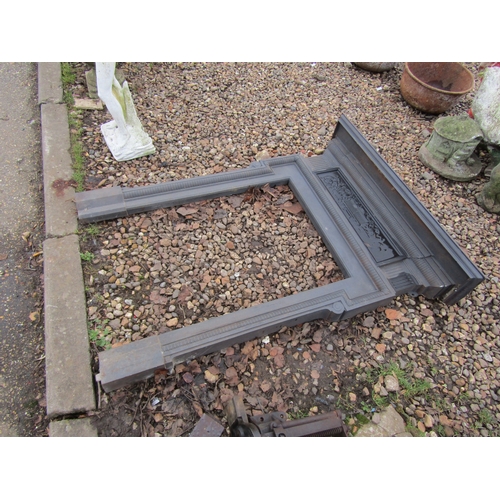 3284 - An iron fire surround. 100cm wide on the mantle x 130cm tall approx. Inner is 56cm wide x 92cm tall ... 