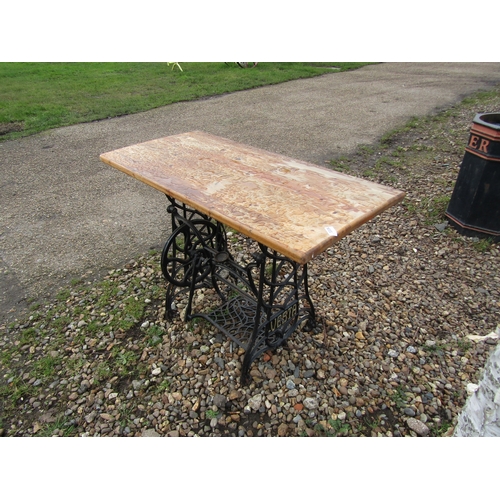 3335 - A Vesta treadle base table with wooden top