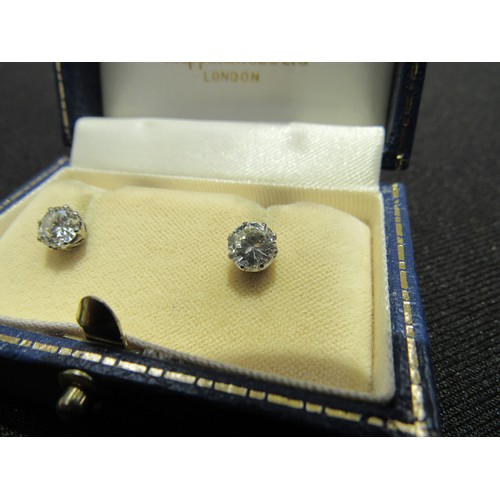 9138 - A pair of diamond stud earrings, 1.50-2ct total approx, 6mm diameter x 4mm deep