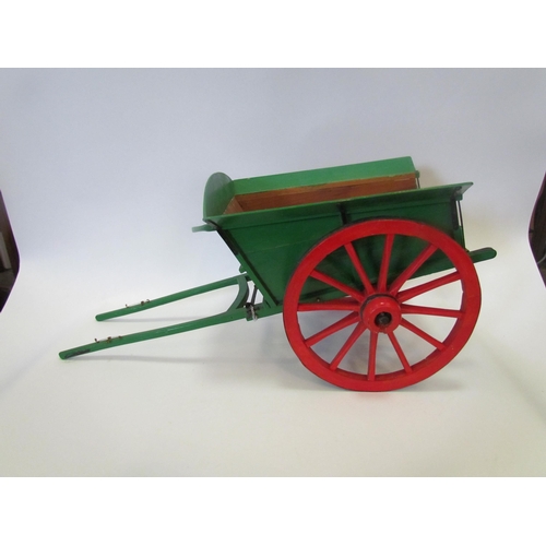 1002 - A handmade model cart, painted green and red, 24cm tall        (E) £15-25