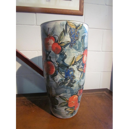 1006 - A hand painted ceramic umbrella stand with fruiting foliage design, 52cm tall