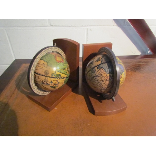 1007 - A pair of desk globe form bookends, 16.5cm tall