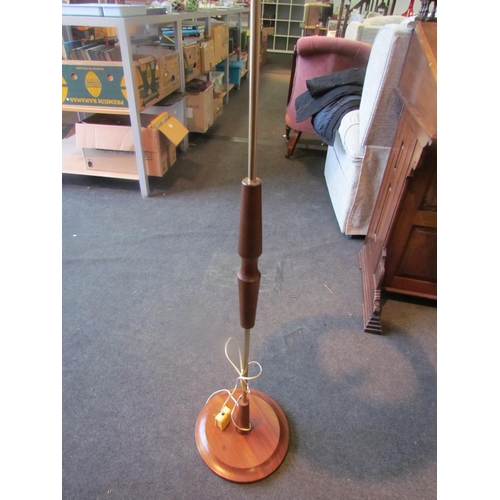 1010 - A retro 1960's teak and metal standard lamp with shade