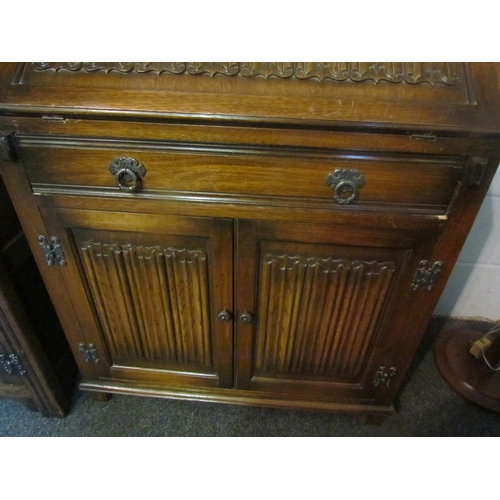 1012 - An Old Charm style oak bureau, linen-fold detail, 98cm tall x 77cm wide x 42cm deep