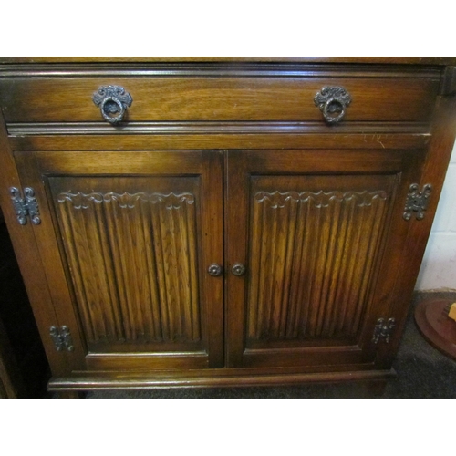 1012 - An Old Charm style oak bureau, linen-fold detail, 98cm tall x 77cm wide x 42cm deep