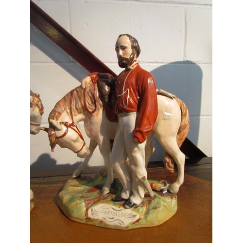 1015 - Two large Staffordshire figures, Garibaldi and Victor Emanuel, one a/f, 36cm x 39cm tall