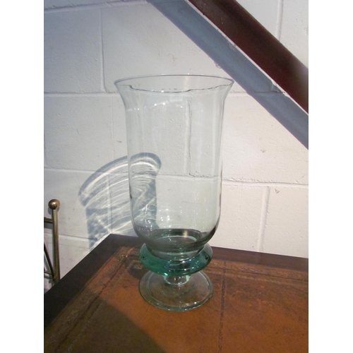 1016 - A large green glass pedestal candle holder, 36cm tall