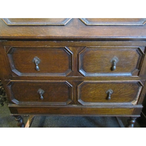 1021 - An early 20th Century geometric oak bureau, two drawers on stretcher base, some moulding missing, 10... 