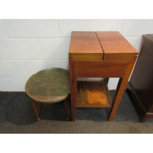 1040 - A teak sewing table with twin lift-lid, together with a brass top occasional table (2)