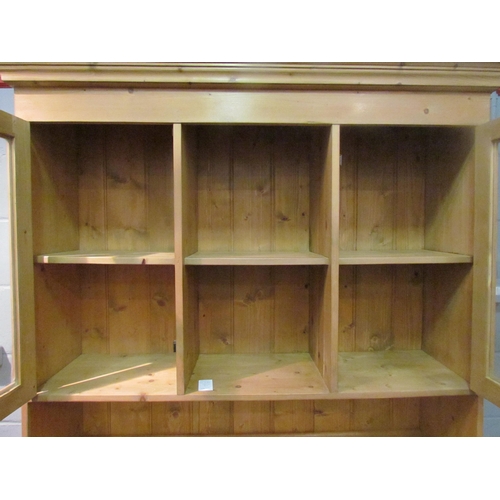 1042 - A modern pine dresser with cupboard and shelf top over three drawer, three door base, 198cm tall x 1... 