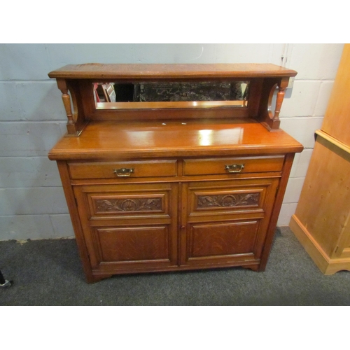 1048 - A circa 1900 walnut mirror back sideboard, the raised back over two drawer and two door cupboard bas... 