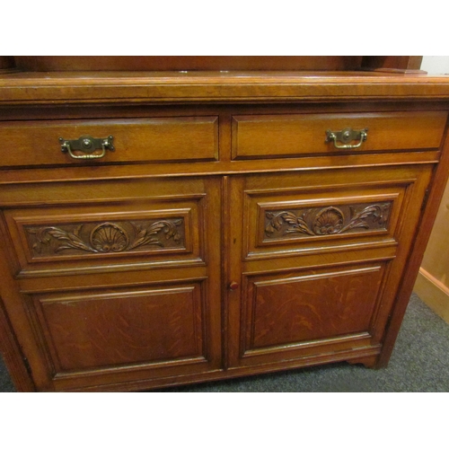 1048 - A circa 1900 walnut mirror back sideboard, the raised back over two drawer and two door cupboard bas... 