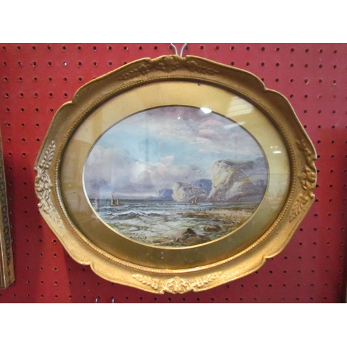 1064 - E.M EARP: A watercolour of coastal scene, boats by cliff side, signed lower left, oval gilt framed a... 