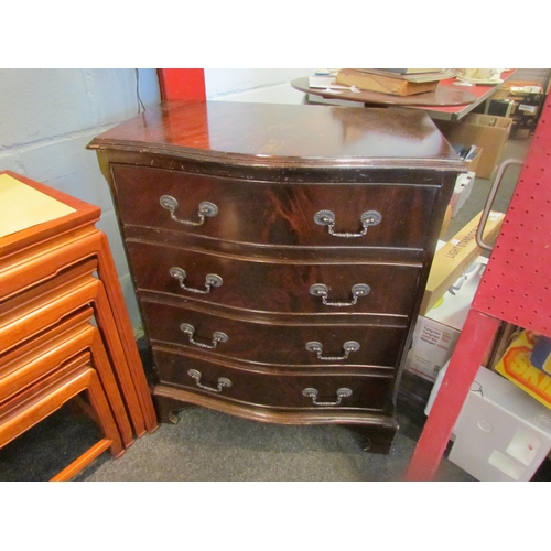 1070 - A reproduction mahogany serpentine fronted bachelor's chest of four long drawers, on bracket feet, 7... 