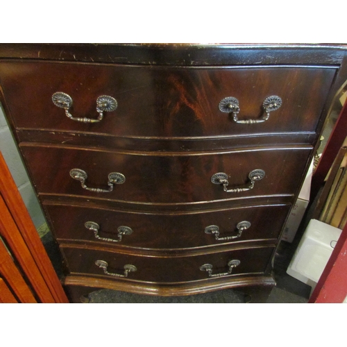 1070 - A reproduction mahogany serpentine fronted bachelor's chest of four long drawers, on bracket feet, 7... 