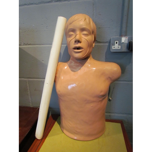 1072 - A resuscitation mannequin with latex covering, 62cm tall, together with a St. John's Ambulance medic... 