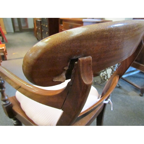 1125 - A Victorian mahogany elbow chair, scroll arms, solid seat, on turned legs, back rest a/f