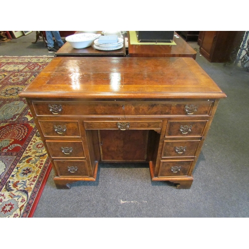 1131 - A child's small kneehole desk, veneered walnut, approximately 18th Century, 71cm tall x 87cm wide x ... 