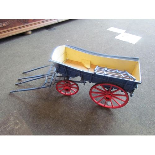 1175 - A handmade model hay cart for a pair of horses, painted blue and red, 24cm tall