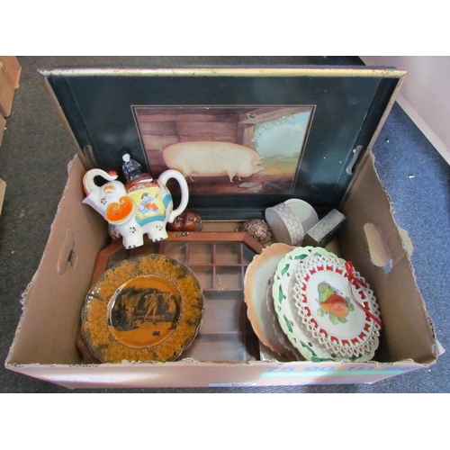 1182 - A box of miscellaneous to include ribbon plates, shells, elephant teapot, tray etc