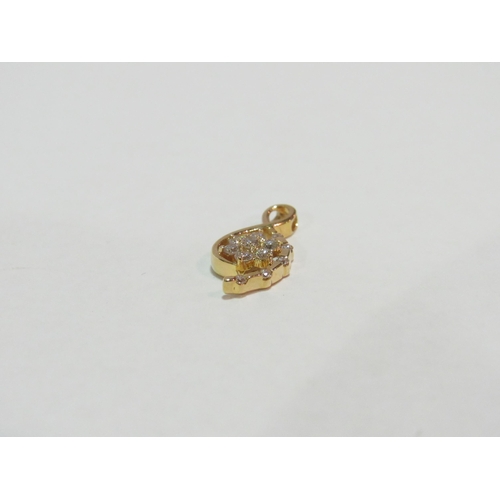 1236 - A gold pendant with a diamond flower motif, stamped 750, 1.3g   (C)