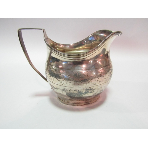 1273 - A Georgian silver cream jug with engraved floral decoration, London 1809, maker's mark rubbed, appro... 