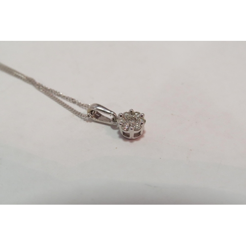 1280 - A 9ct white gold diamond set cluster pendant on 9ct white gold chain