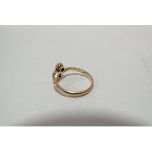 1295 - A pearl crossover ring, stamped 18ct. Size L, 2.6g  (C)