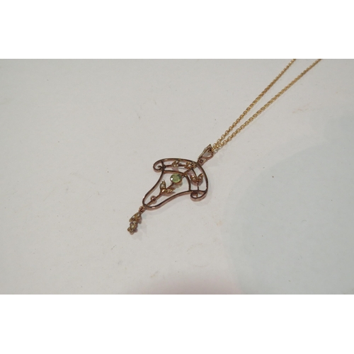 1301 - A 9ct gold chain hung with a seed pearl and green stone Art Nouveau style pendant, stamped 9ct, 4g  ... 