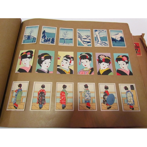 5127 - Three albums of match box covers to include early 20thc examples, Japanese, Russian and Continental ... 