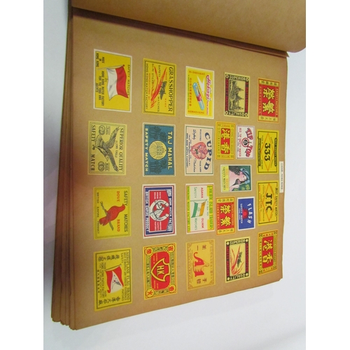 5127 - Three albums of match box covers to include early 20thc examples, Japanese, Russian and Continental ... 