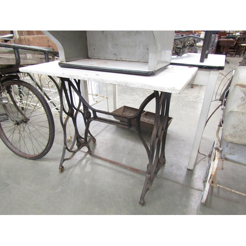 2019 - An iron treadle base table with marble top   (E)  £10-20