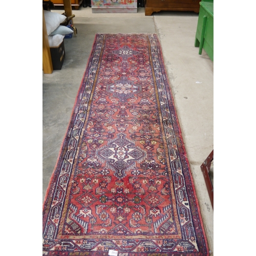 2321 - A red and blue runner rug 300 x 82cm