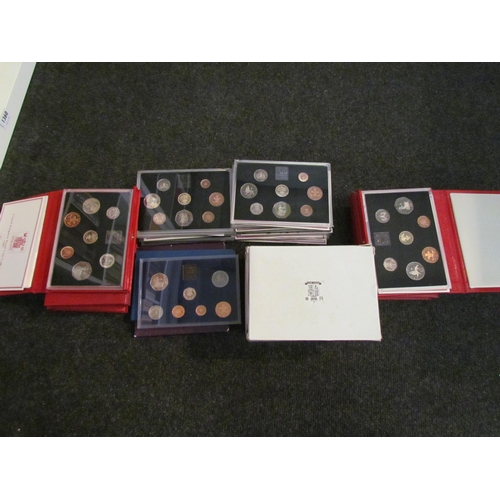 1354 - A collection of UK decimal proof sets of the 1980's and 90's, 2006 80th Birthday crown, etc