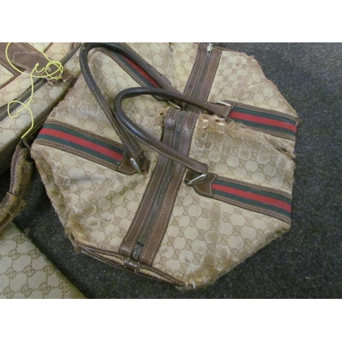 1415 - A vintage Gucci suitcase, bag and travel wallet, well used