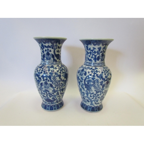 1437 - A pair of 20th Century Oriental blue and white vases with koi and floral design, 