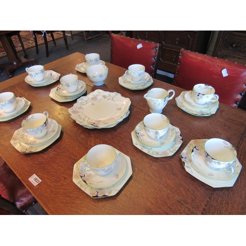 1022 - A Paragon Art Nouveau pattern tea set, two bread and butter plates, 12 tea plates, 12 saucers, ten c... 