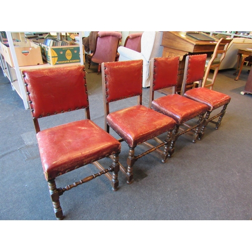 1024 - A set of four 1940's oak framed Cromwellian style dining chairs, studded upholstery